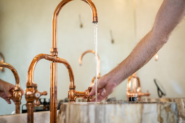Copper faucet with running water